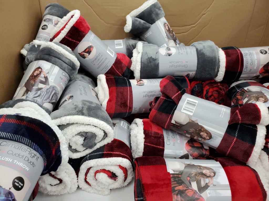 walmart display box full of cuddl duds throws with sherpa foot pockets
