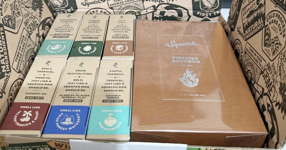 six bars of dr squatch soap and a bottle of cologne in box