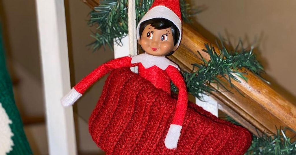 elf on a shelf in a christmas stocking