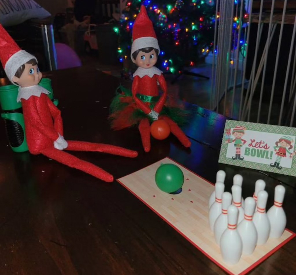 two elf on the shelf with bowling set
