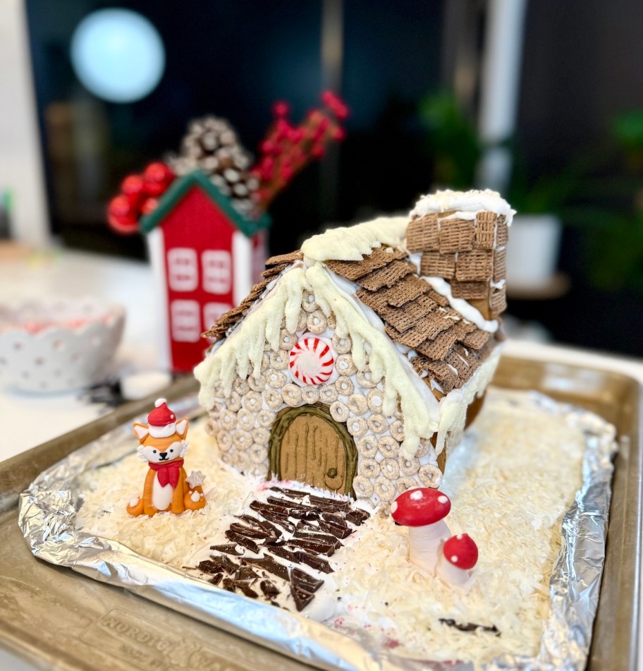 gingerbread house with cherrios and chex tiles on roof