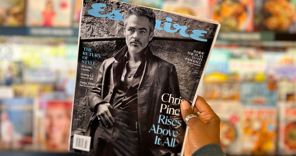 hand holding esquire magazine in store
