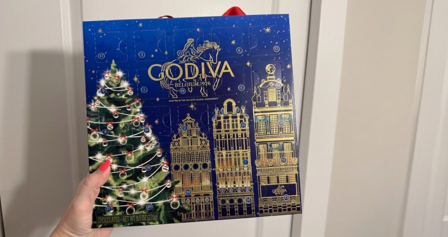 hand holding a godiva advent calendar