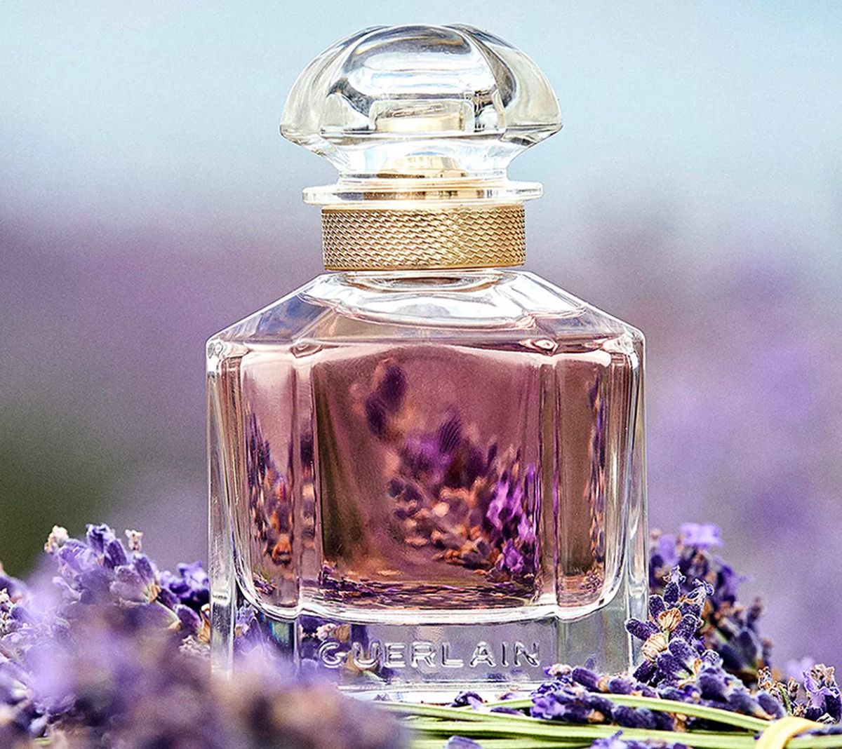 guerlain Mon Guerlain Eau de Parfum Spray surrounded by lavender blooms 