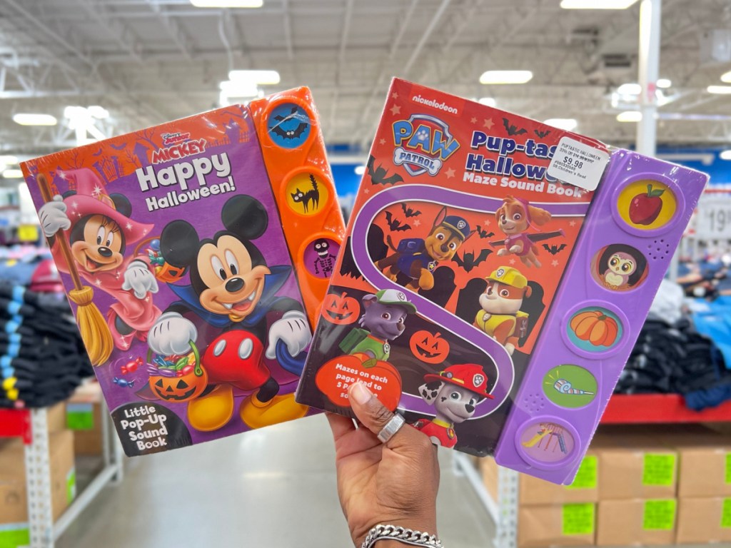 hand holding Disney Mickey Mouse Clubhouse - Happy Halloween Sound Book at the sams store