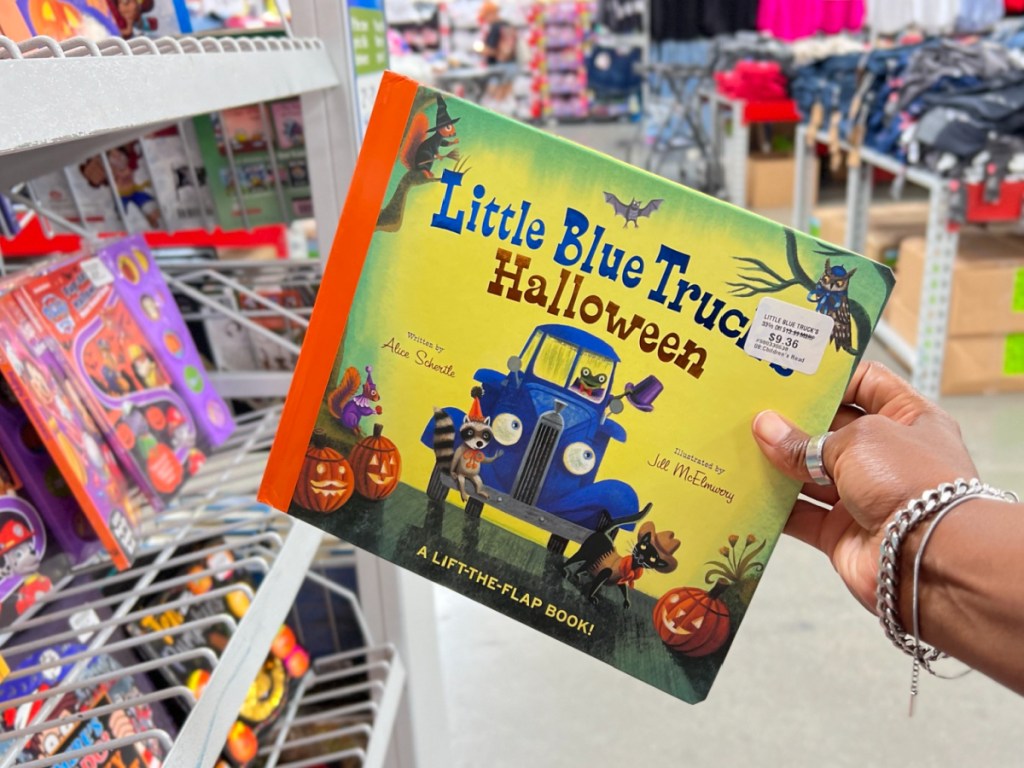 hand holding Little Blue Truck's Halloween  at the Sams club store