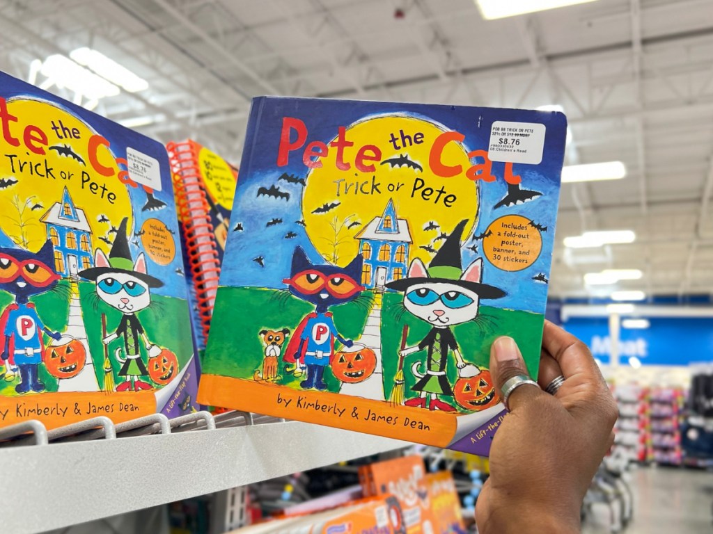 hand holding Pete the Cat_ Trick or Pete at the sams store