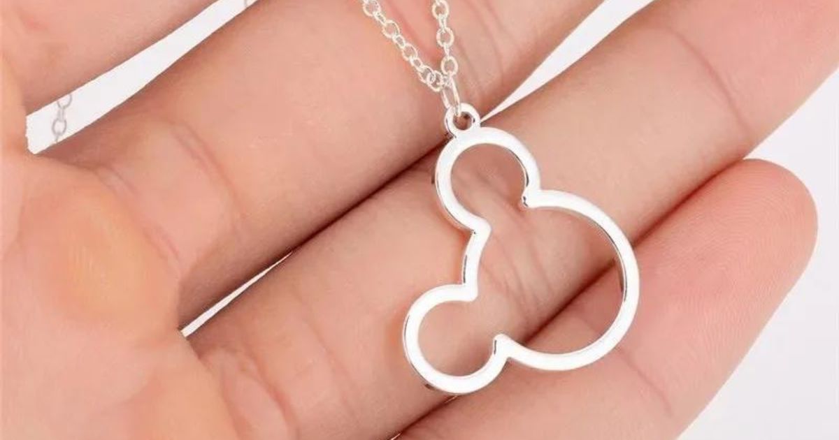 hand holding mouse ears necklace
