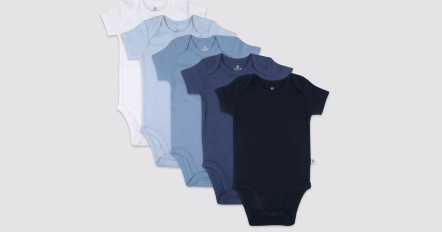 5 pack of honest baby bodysuits on grey background
