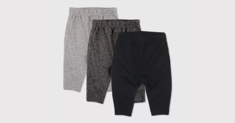 3 pack of baby pants on grey background