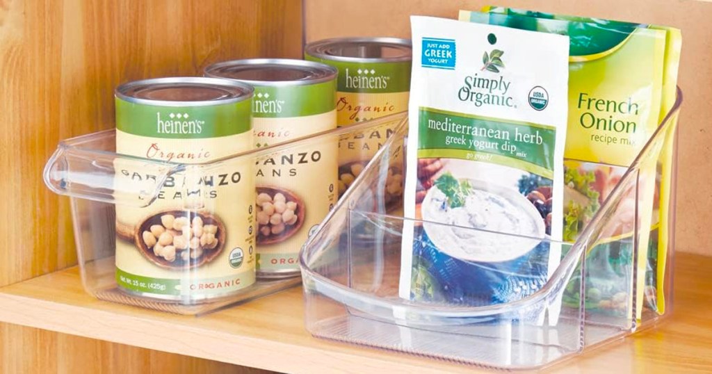 organizer bins with food in cabinet