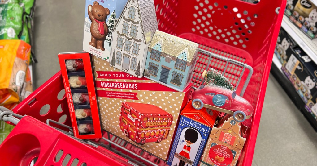 Target shopping cart full of Christmas cookie tins