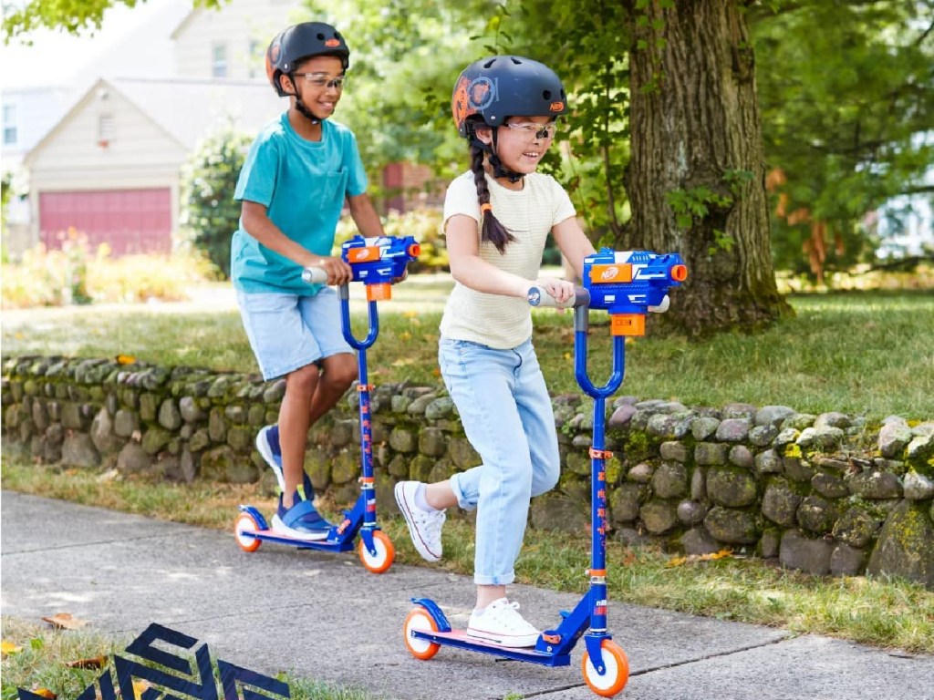 kids riding nerf blaster scooters