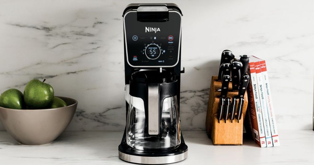 silver and black coffee maker on counter
