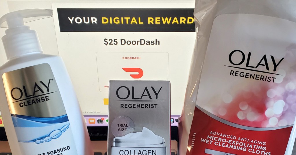 Olay products in front of computer screen with digital reward displayed 