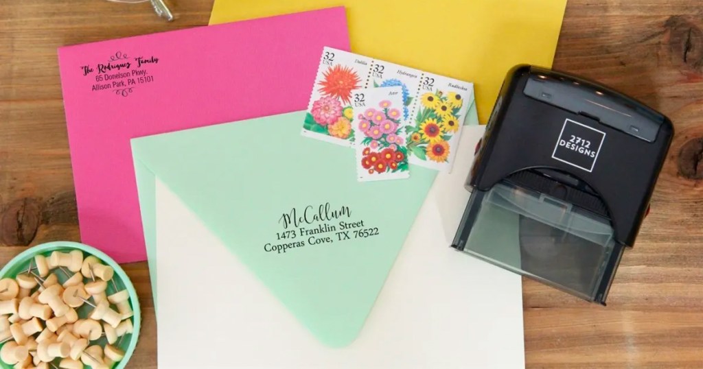 personalized stamper with envelopes on table