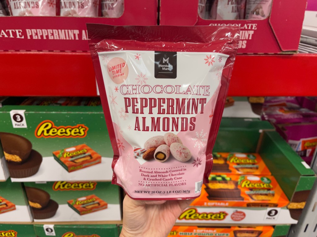 bag of peppermint almonds held up in a sams club store