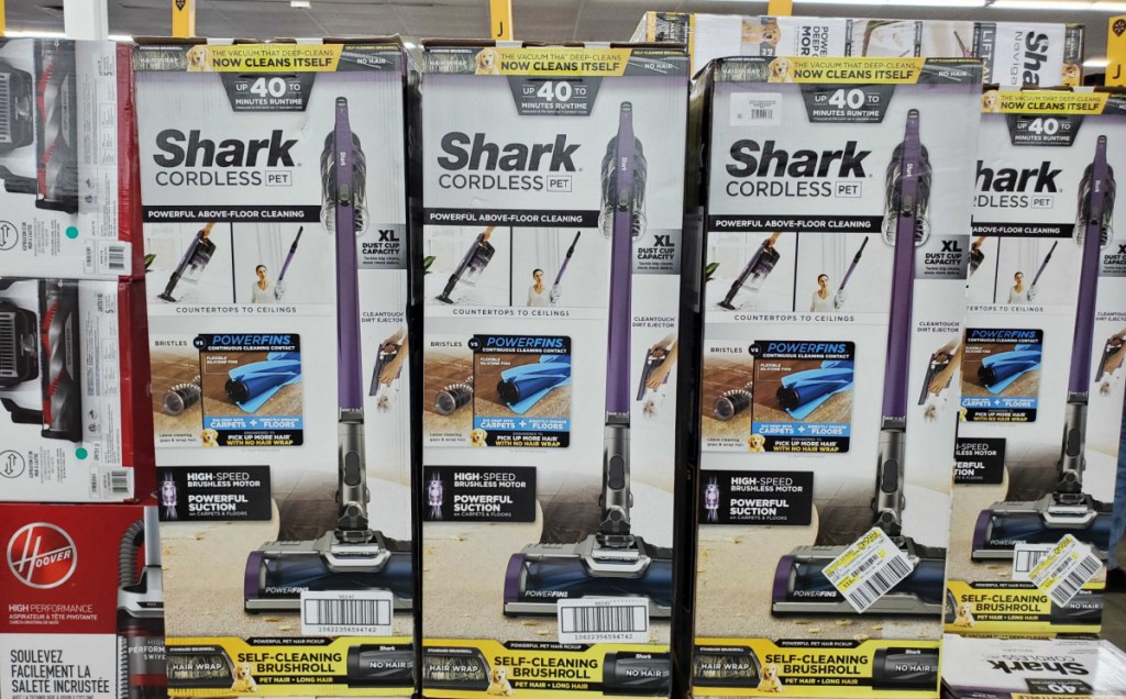 shark cordless pet vacuums in packaging stacked up in store