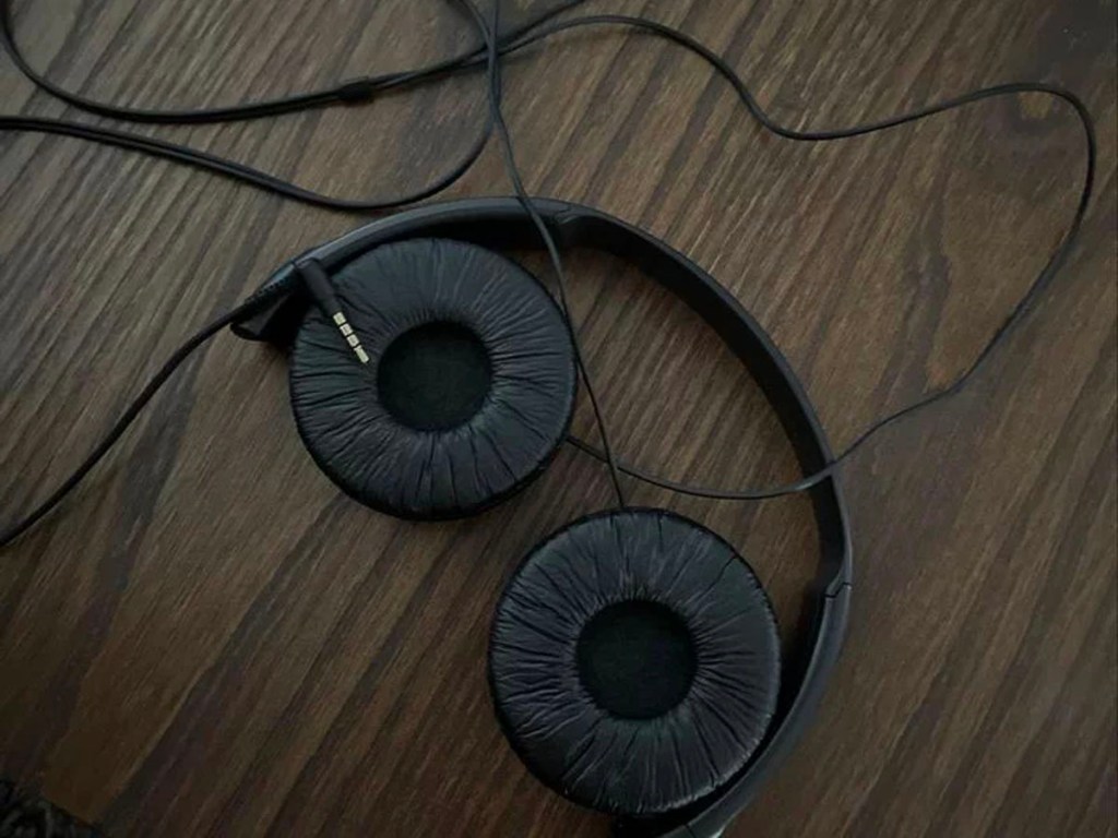 black sony zx wired headphones laying on table