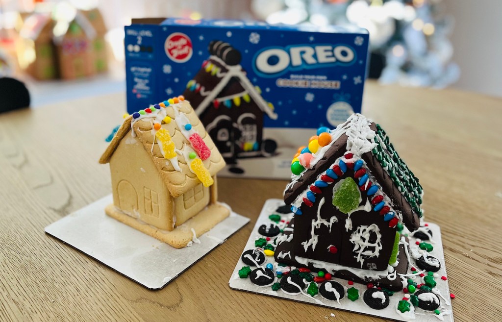 sour patch kids and oreo cookie gingerbread houses on table