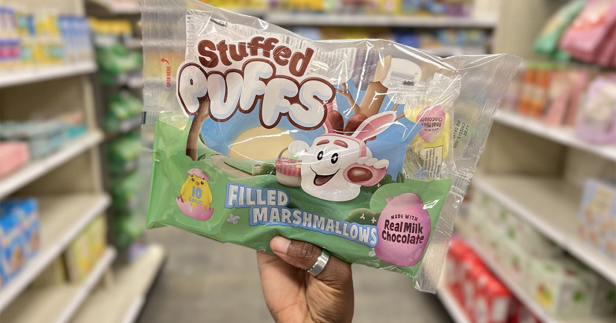 hand holding stuffed puffs filled marshmallows bag