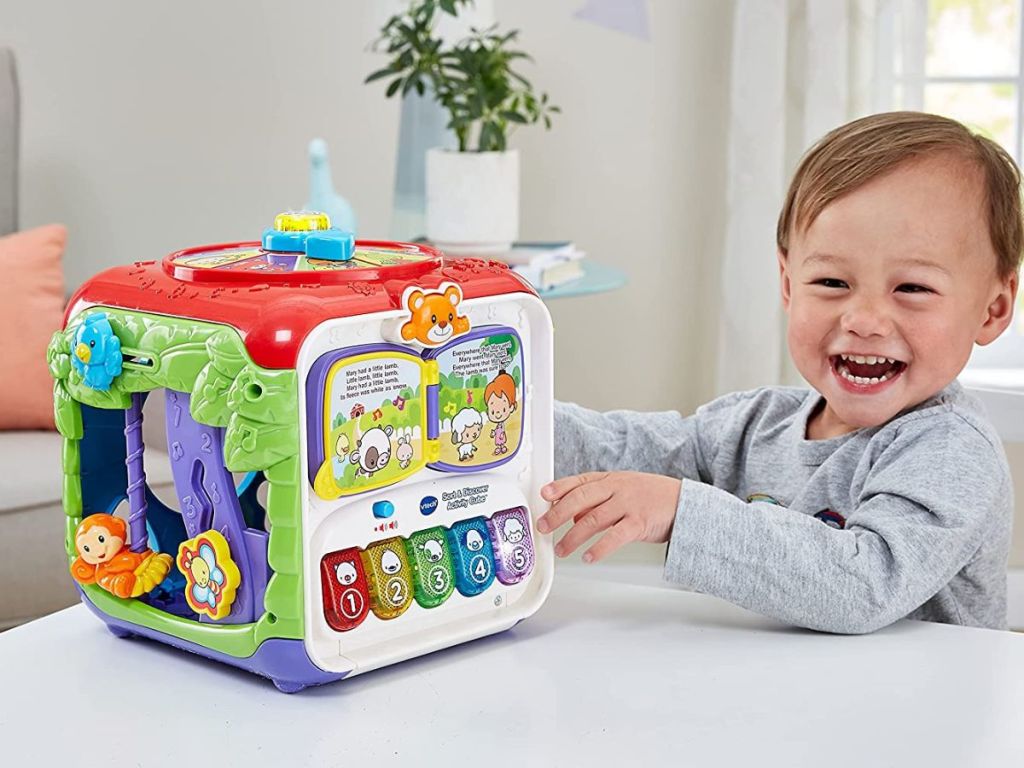 kid playing with vtech activity cube