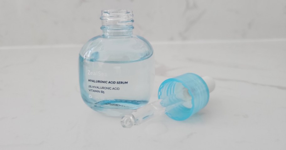 blue bottle of serum with dropper