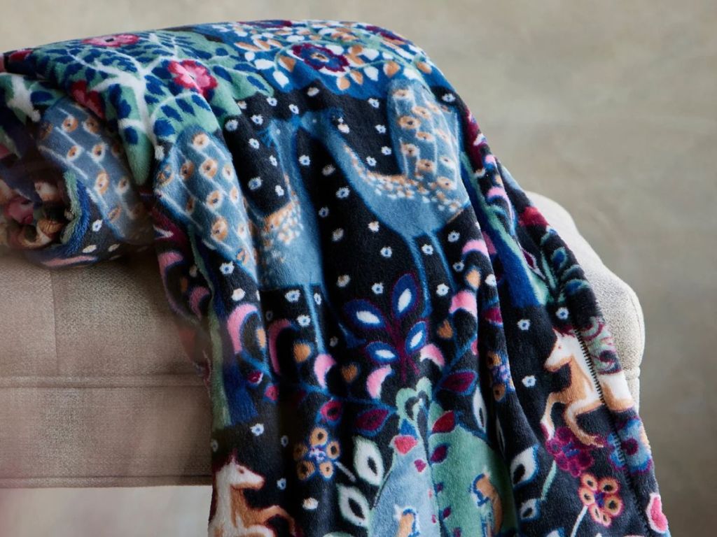 Vera Bradley Plush Throw Blanket spread out over chair
