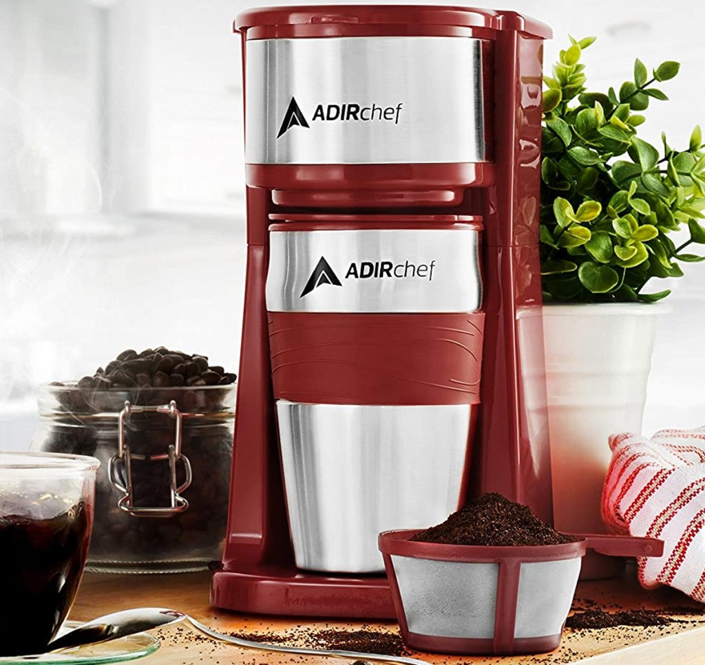 red and silver coffee maker with travel cup