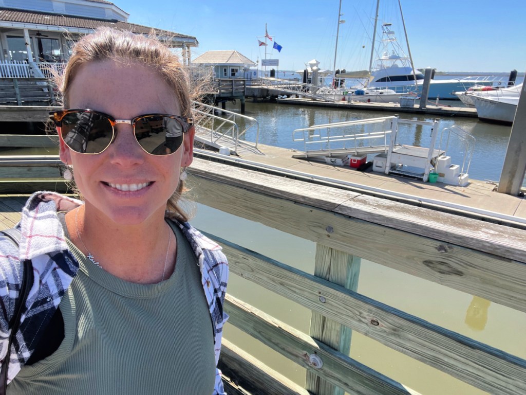 Woman standing on a Florida pier in Amelia Island