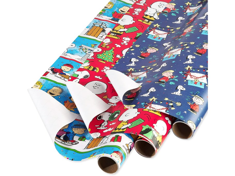 three rolls of peanuts christmas wrapping paper