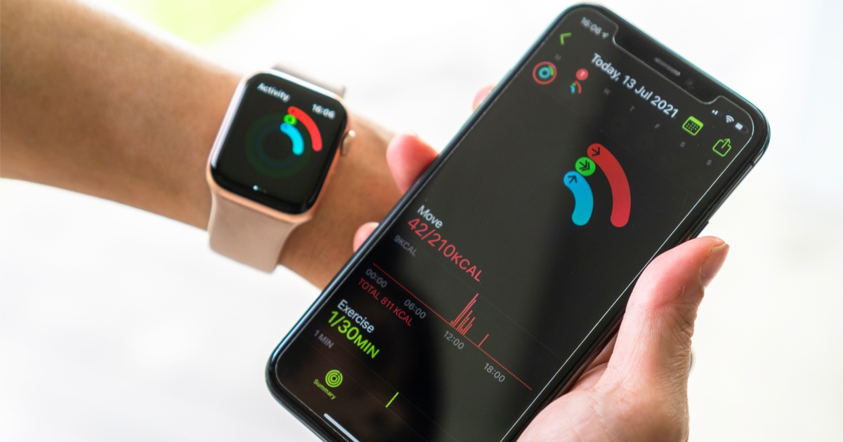iphone and apple watch with apple fitness displayed