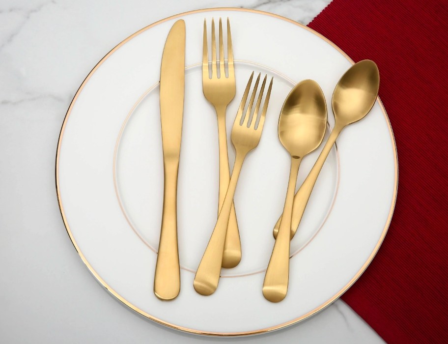 better homes & gardens matte gold flatware set on dining plate