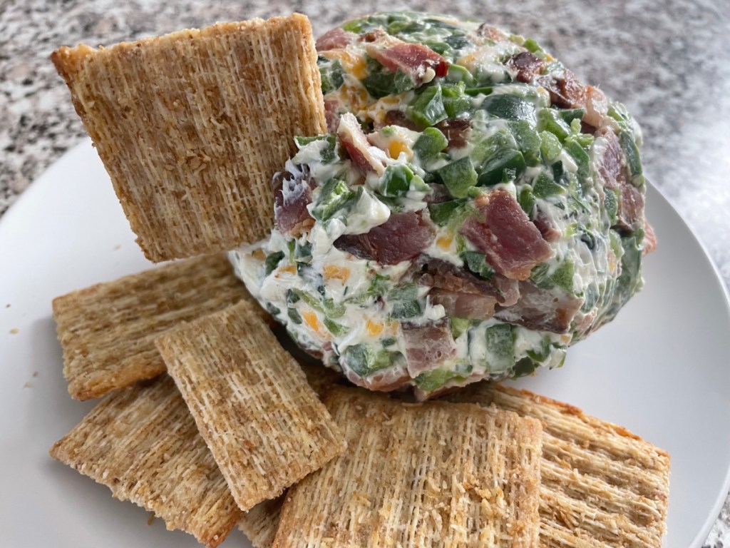A jalapeno cheese ball served with triscuits