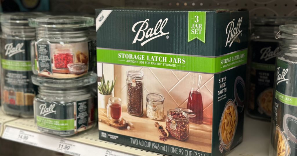 glass storage containers in box on shelf
