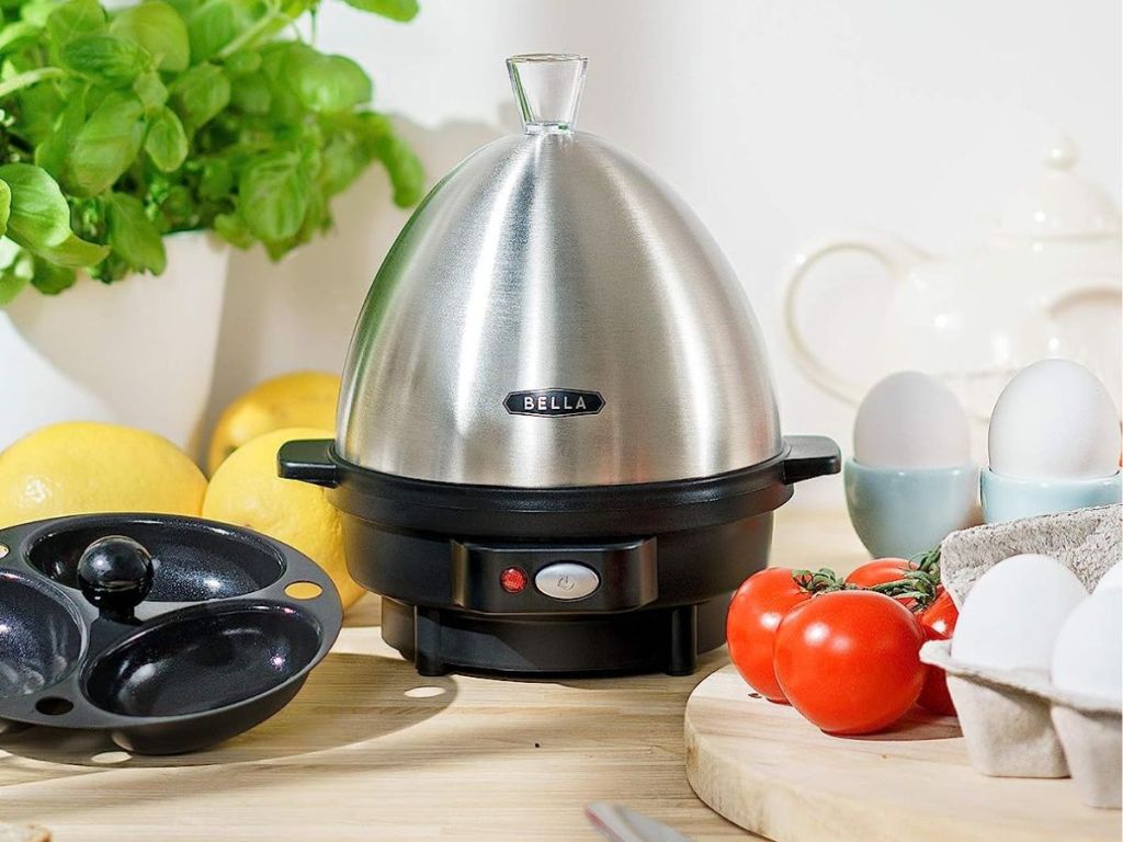 Bella egg cooker with eggs and tomatoes next to it