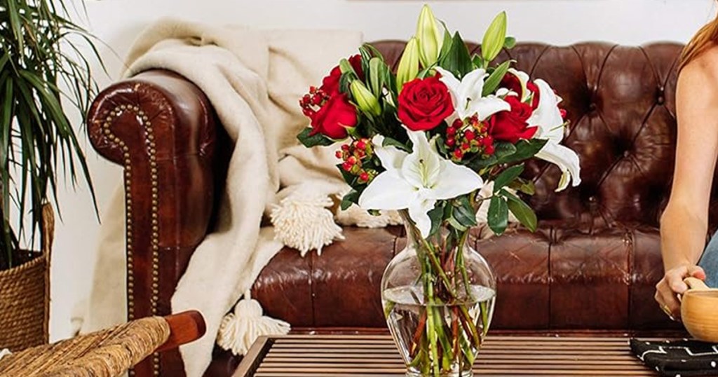 vase of white lilies and red roses on coffee table