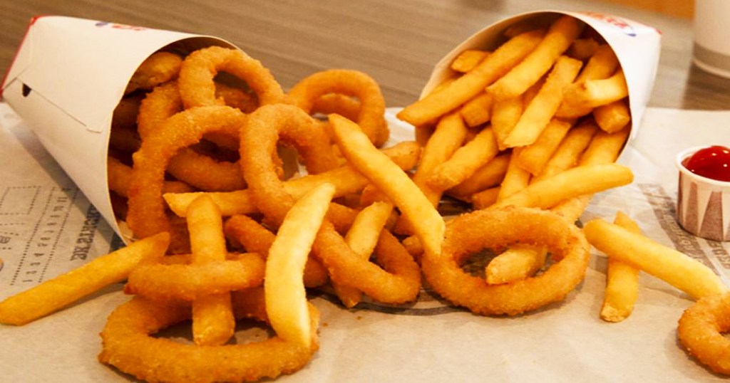 two containers of burger king onion rings and fries