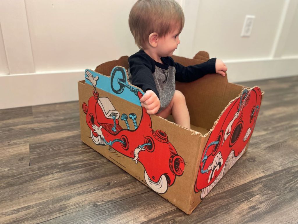 boy sitting in a box
