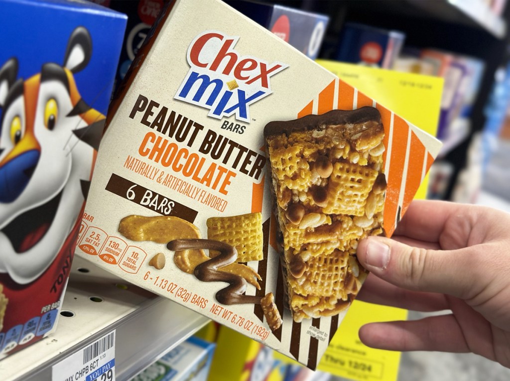 grabbing box of chex mix bars from store shelf