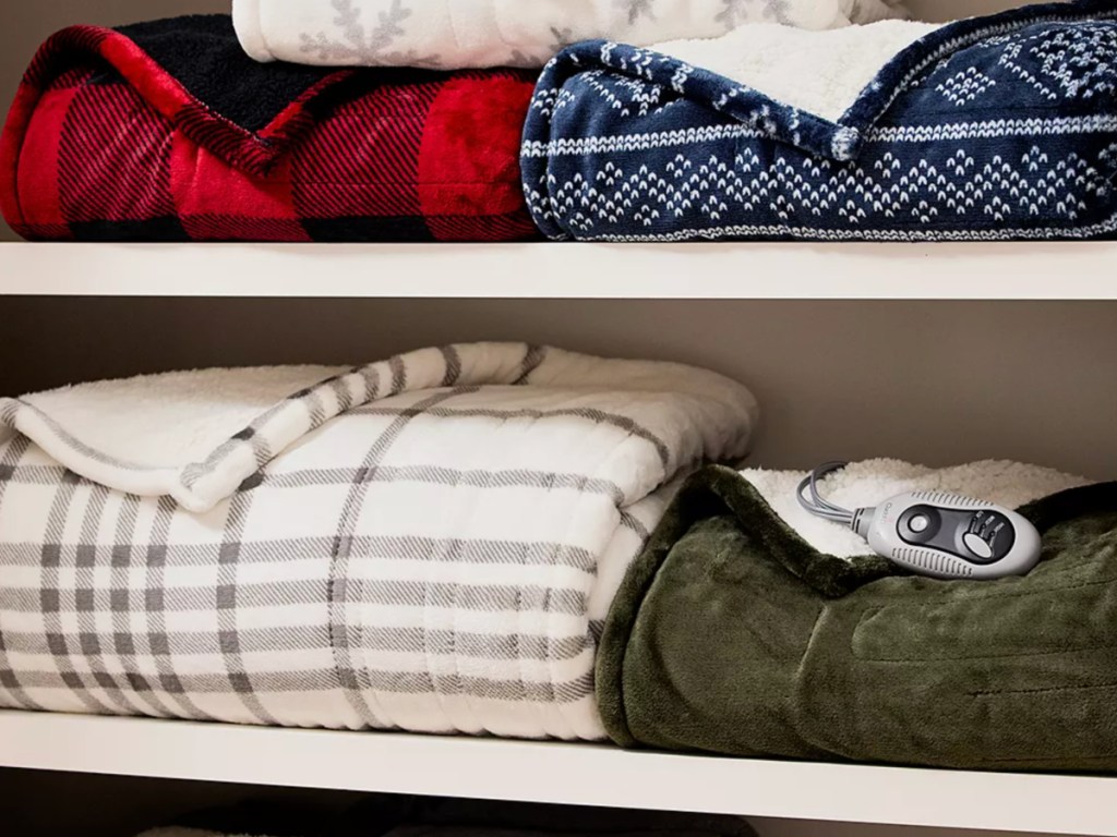 Cuddl Duds heated throws in cabinet