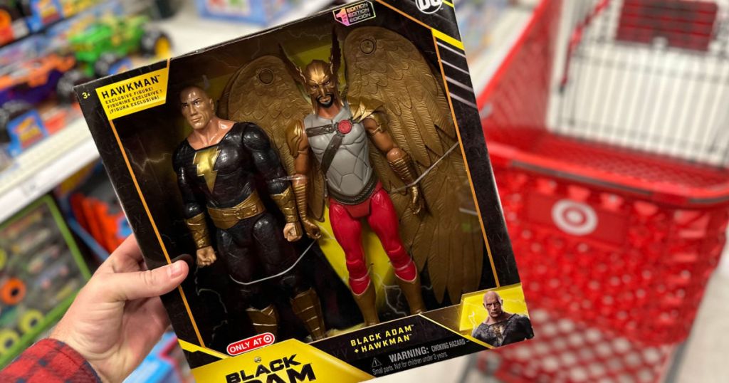 hand holding action figure set