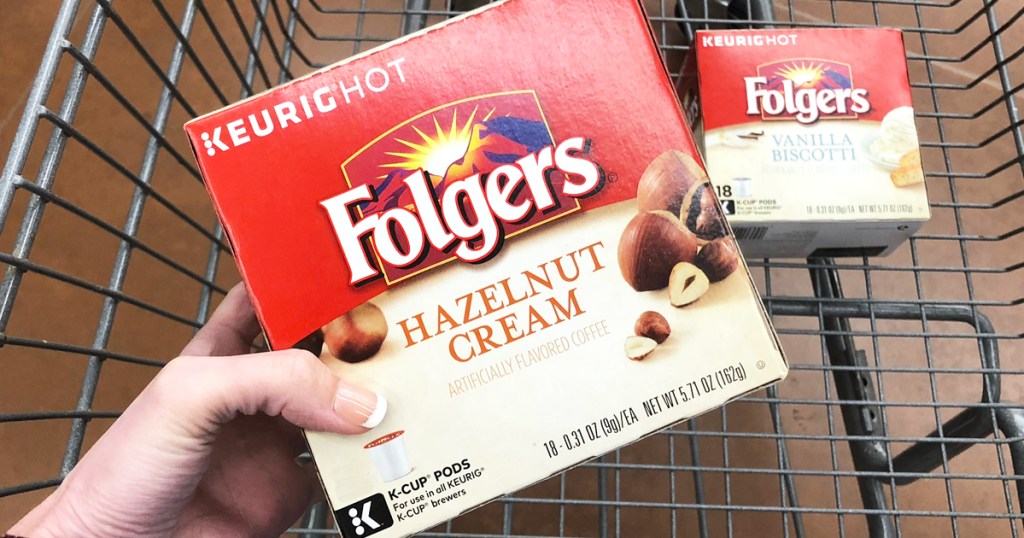 hand holding box of Folgers Hazelnut Cream Flavored Coffee K-Cups