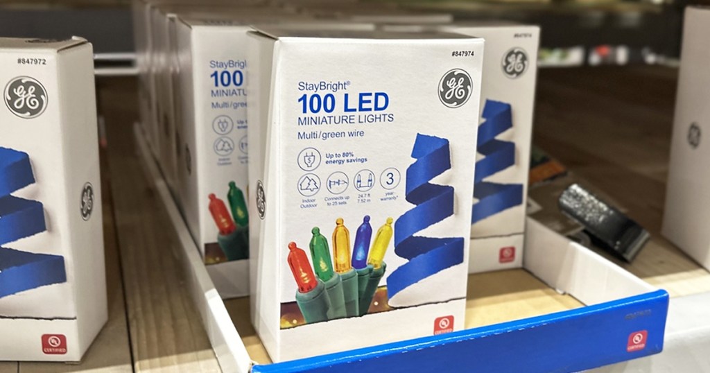boxes of GE StayBright string lights on store shelf
