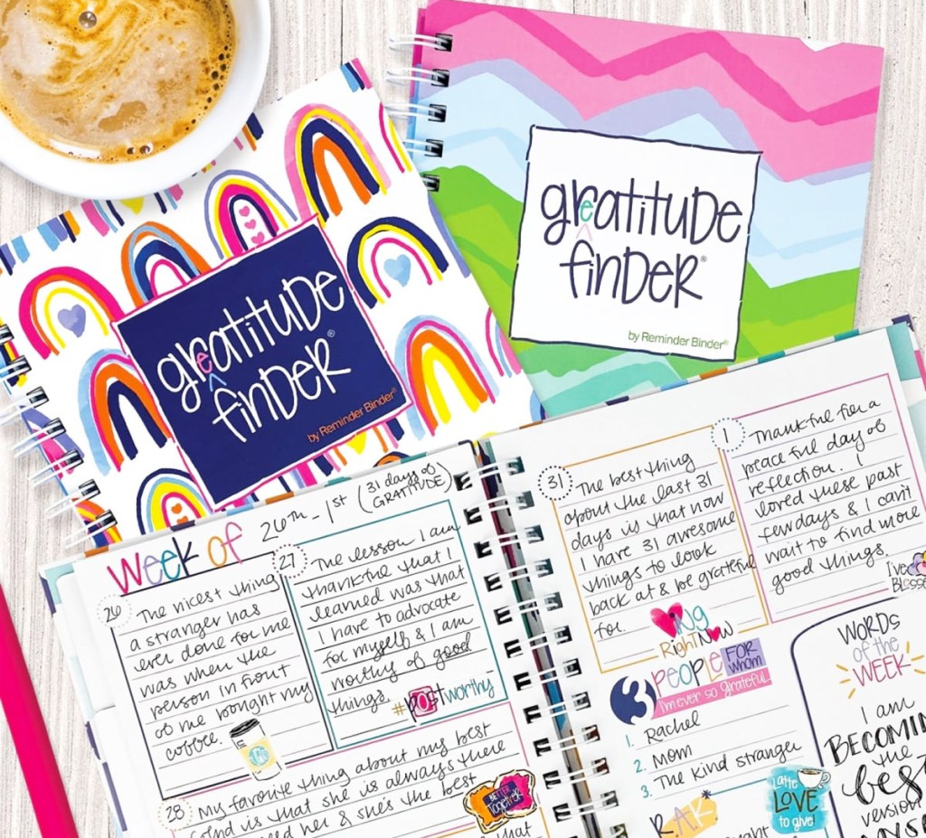opened gratitude journal with two behind it