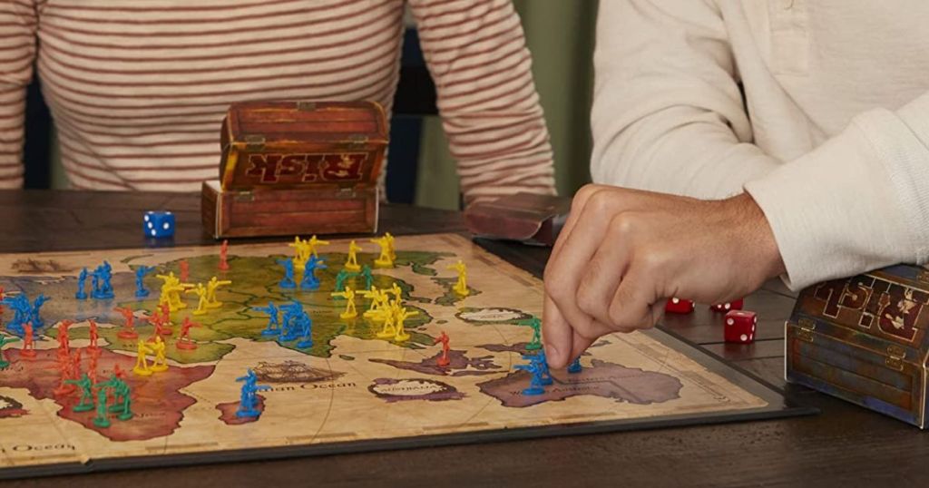 People playing the Hasbro Risk board game