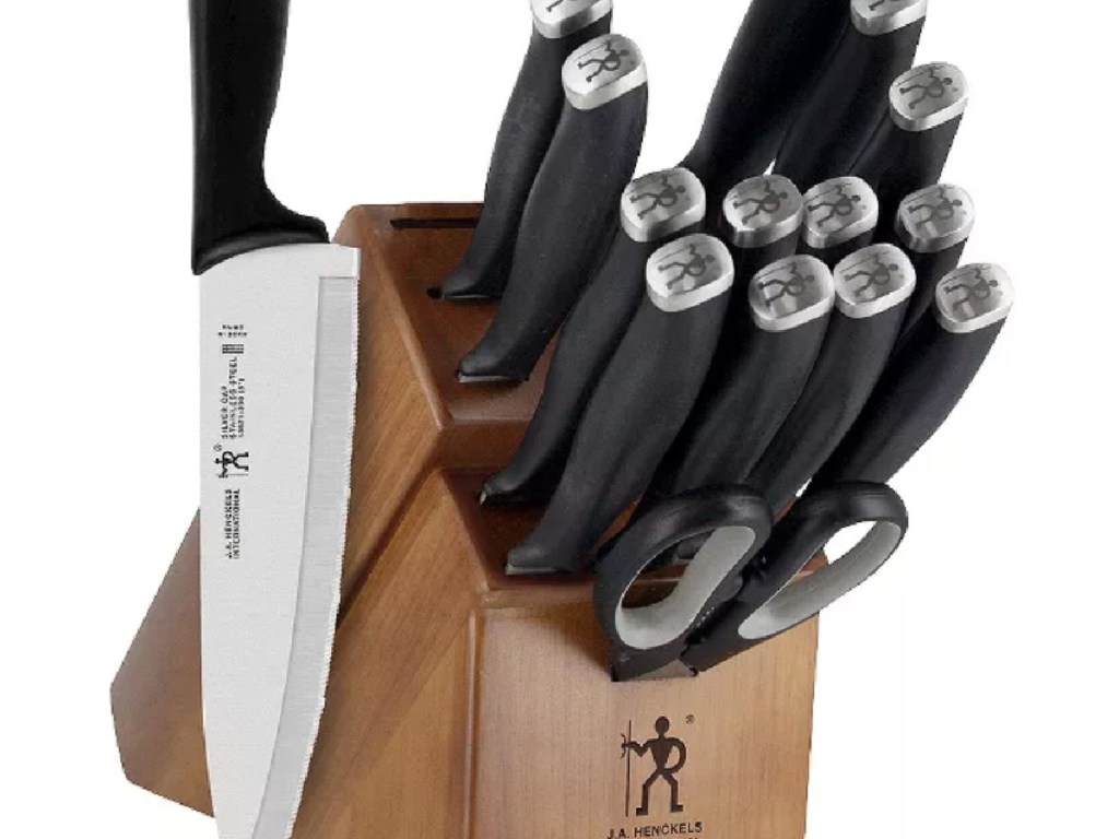 black and steel knives in wooden block