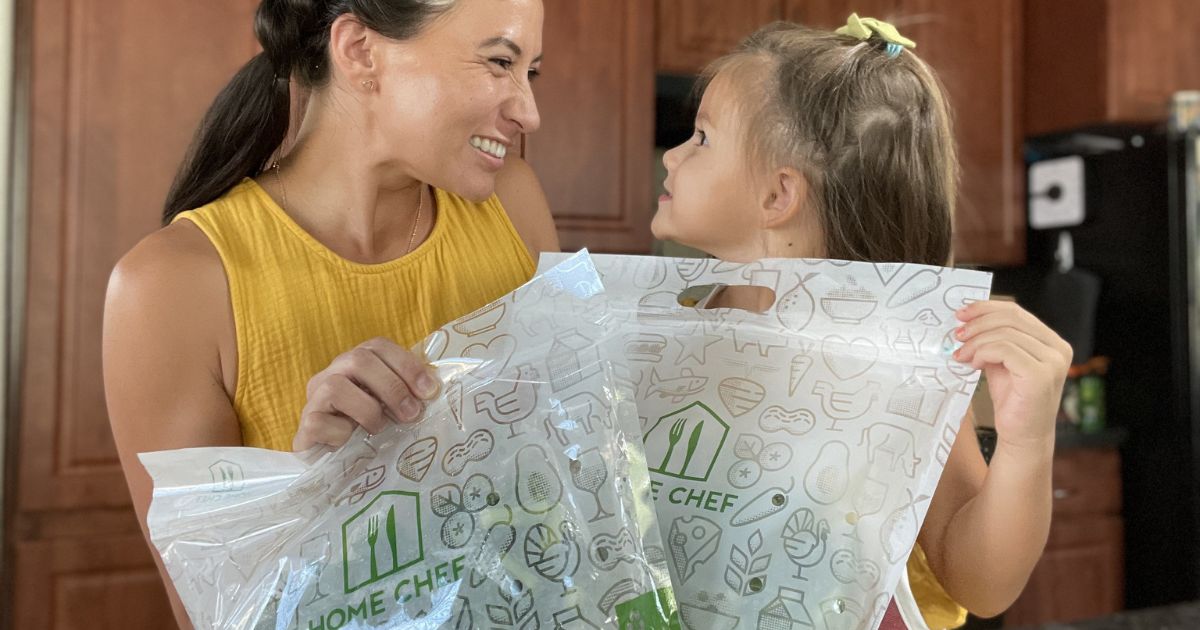 woman and little girl holding up Home Chef bags