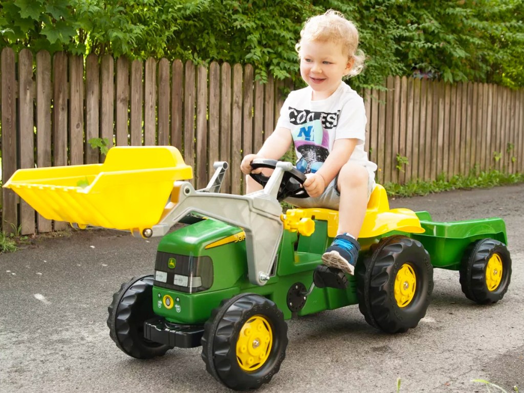 boy riding on a John Deere Front Loader Tractor Ride-On