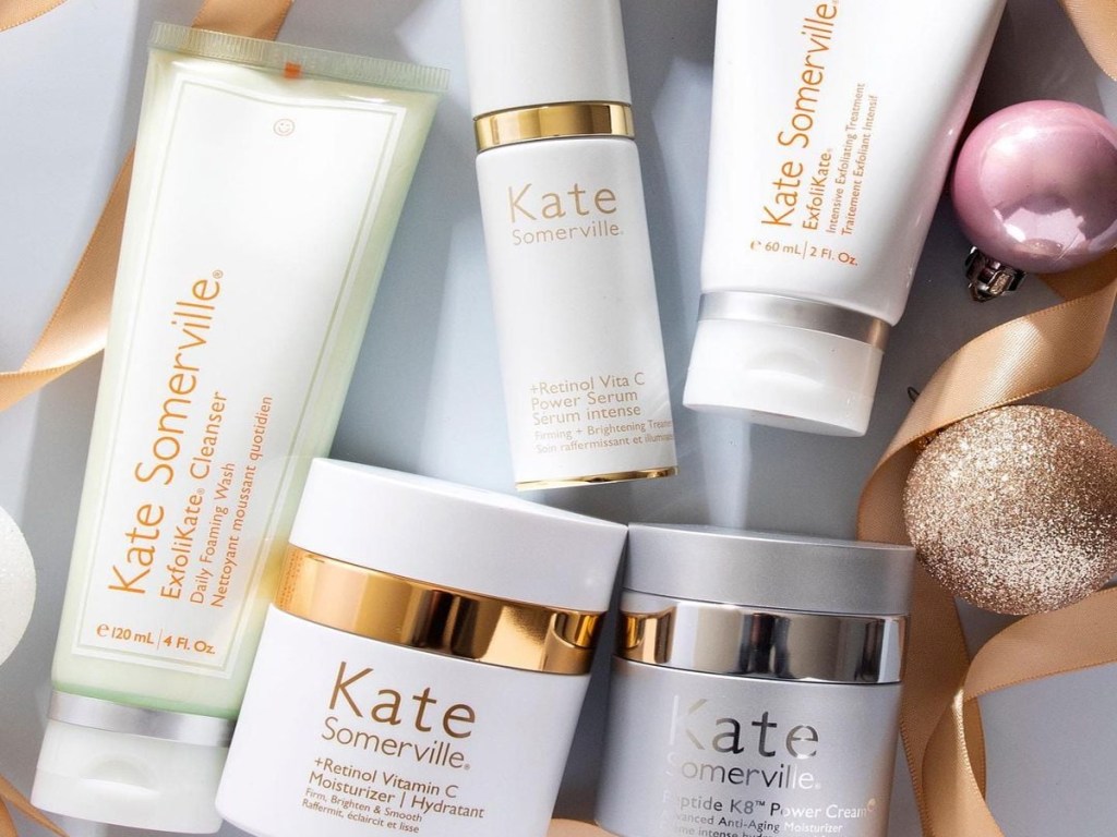 kate somerville skincare products with ribbons and ornaments around them